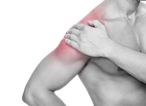 dor na região lateral do braço compatível com lesão do manguito rotador